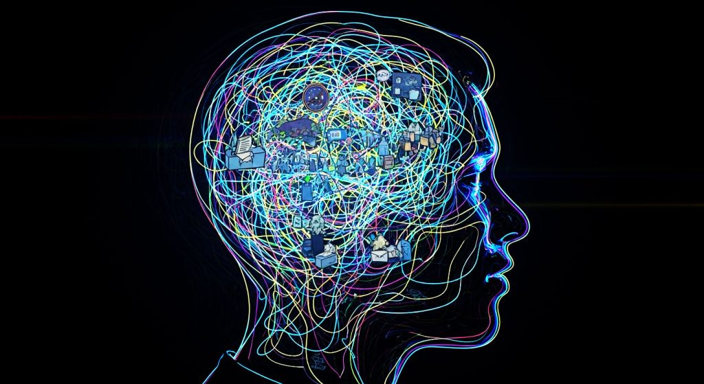 A cabeça de uma pessoa com uma teia de fios emaranhada e intricada dentro, simbolizando a natureza constante, esmagadora e interconectada dos pensamentos e preocupações no Transtorno de Ansiedade Generalizada.